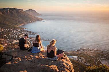 Travellers enjoy the spectacular view from the top of Lion's Head.