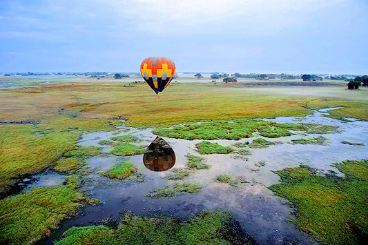 Hot air balloon drifting above Kafue National Park, Zambia