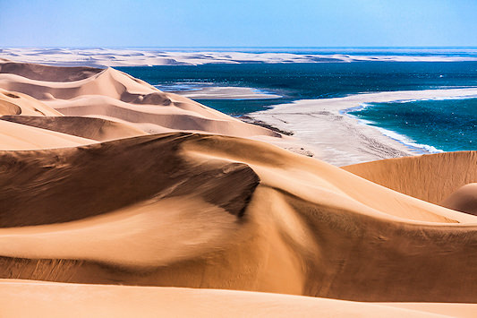 Tall dunes meeting the Atlantic Ocean on the Skeleton Coast, Namibia