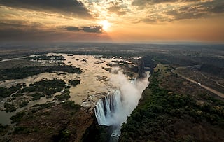 Aerial view of Victoria Falls at sunset